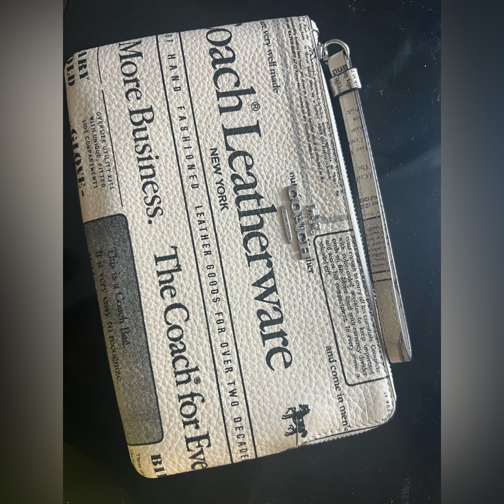Coach Newspaper print Leather Clutch